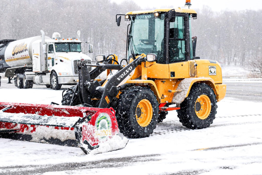 Nardos Commercial Snow Tractor Removing Snow in Ashland Ohio Parking Lot